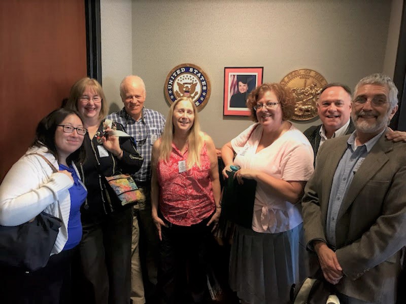 group-of-cpfa-members-stand-in-legistlators-office-reception