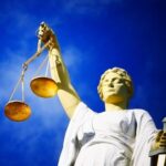 scales-of-justice-statue-standing-for-human-rights