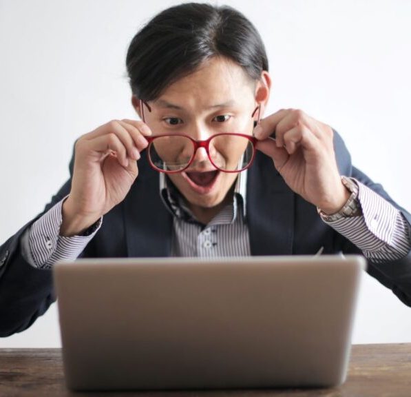 man-surprised-looking-at-laptop