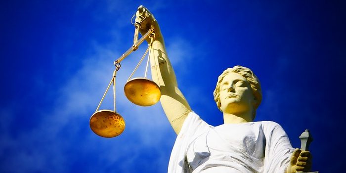 scales-of-justice-statue-standing-for-human-rights