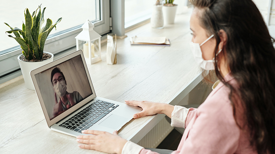 woman-having-a-video-call-wearing-face-mask
